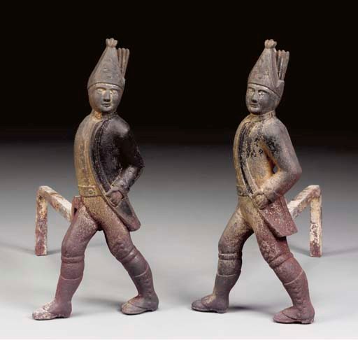 A PAIR OF CAST IRON HESSIAN SOLDIER ANDIRONS