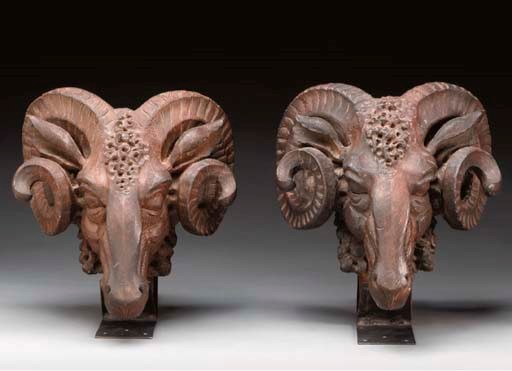 A PAIR OF BIGHORN RAM CARVED WOOD HEADS