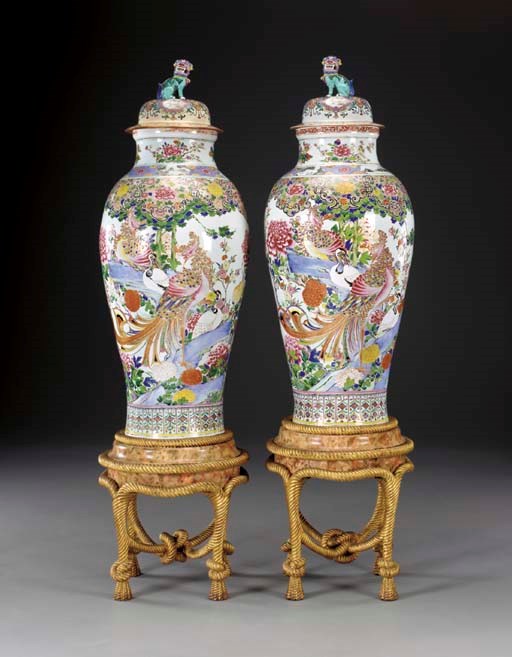 A PAIR OF FAMILLE ROSE SOLDIER VASES AND COVERS