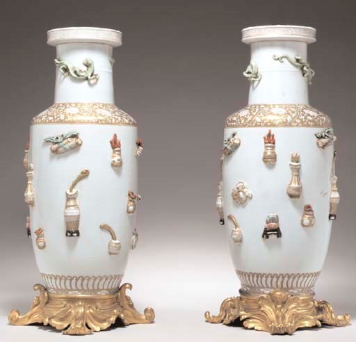 A PAIR OF GILT BRONZE-MOUNTED ROULEAU VASES