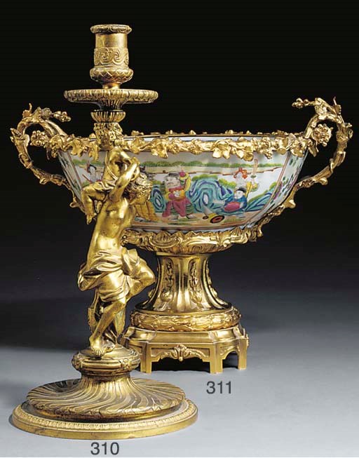 AN ORMOLU FIGURAL CANDLESTICK