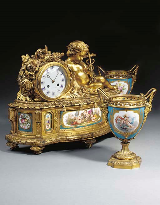 A NAPOLEON III GILT BRONZE AND PORCELAIN MANTEL CLOCK