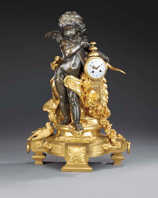 A CONTINENTAL GILT AND PATINATED BRONZE MANTEL CLOCK