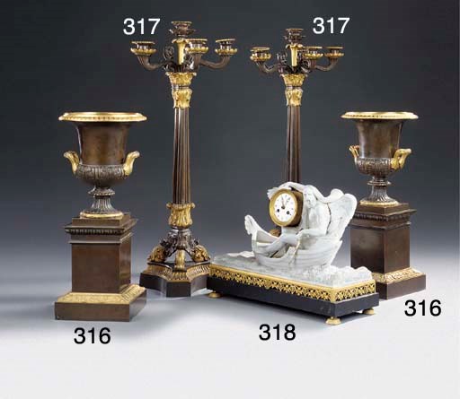 A PAIR OF FRENCH GILT AND PATINATED BRONZE SIX-LIGHT CANDELABRA