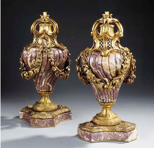 A PAIR OF GILT BRONZE AND VARIEGATED PINK MARBLE TABLE LAMP BASES