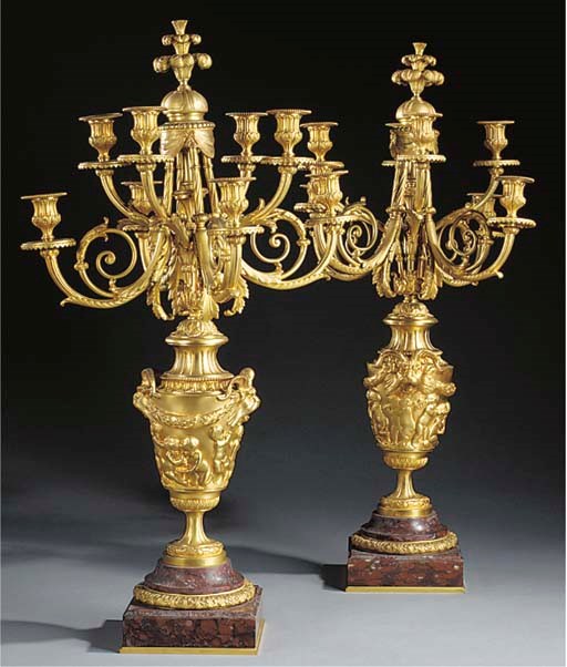 A PAIR OF FRENCH GILT BRONZE EIGHT LIGHT CANDELABRA