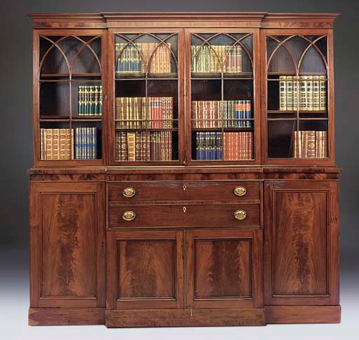A MAHOGANY BREAKFRONT SECRETAIRE LIBRARY BOOKCASE