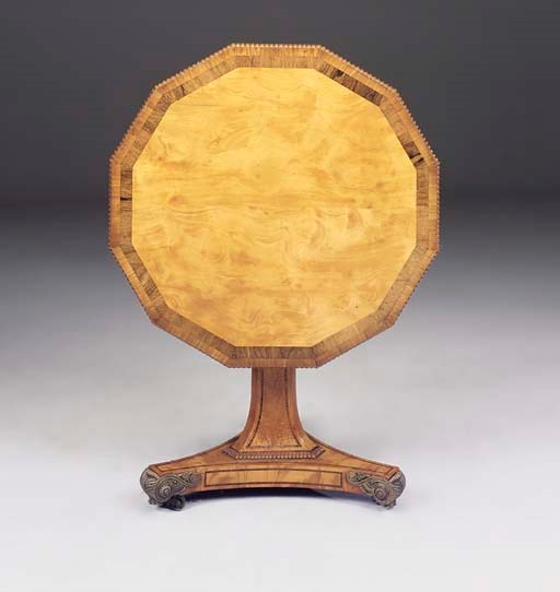 A REGENCY SATINWOOD AND ROSEWOOD BANDED POLYGONAL CENTRE TABLE