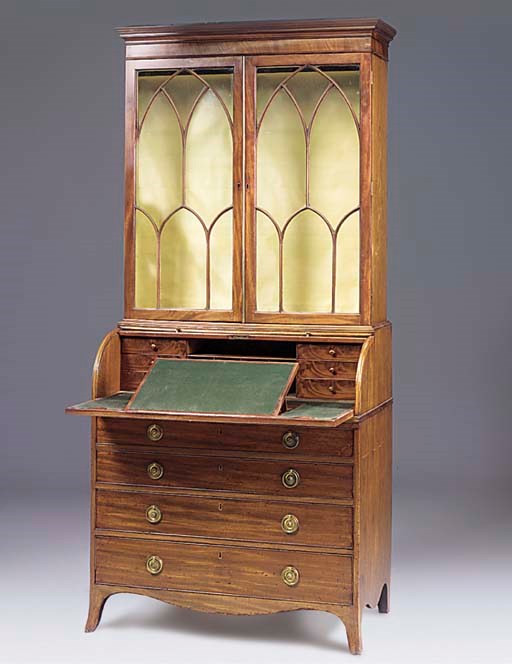 A LATE GEORGE III MAHOGANY CYLINDER BUREAU BOOKCASE