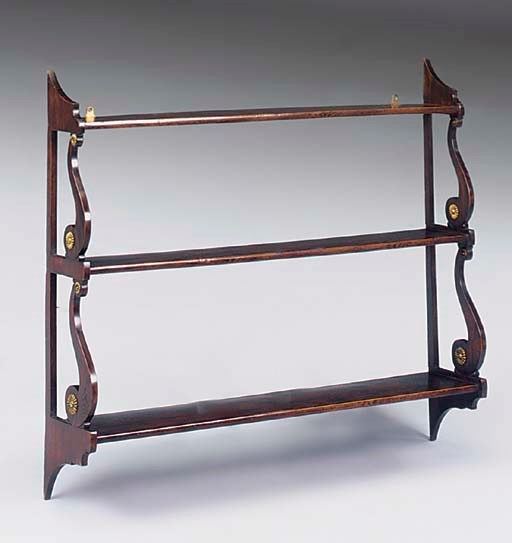 A REGENCY SIMULATED ROSEWOOD AND BRASS MOUNTED SET OF THREE TIER HANGING SHELVES