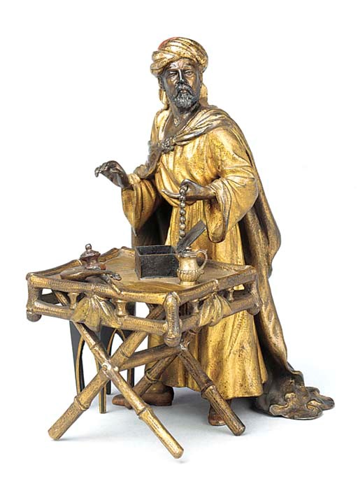 AN AUSTRIAN COLD PAINTED BRONZE OF AN ANTIQUE SELLER