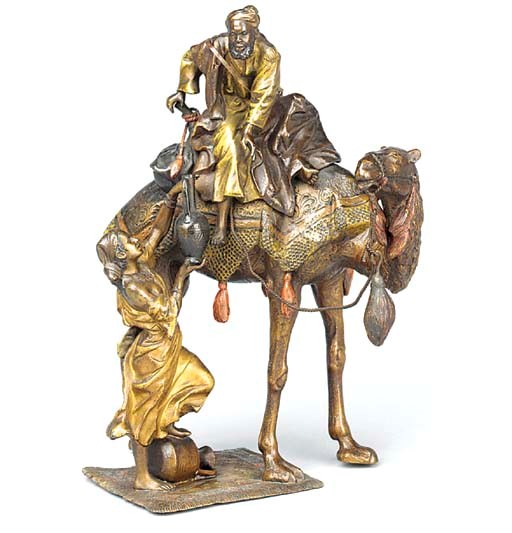 AN AUSTRIAN COLD PAINTED BRONZE GROUP OF A WATER CARRIER