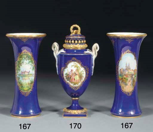A pair of Meissen dark-blue ground topographical beaker vases