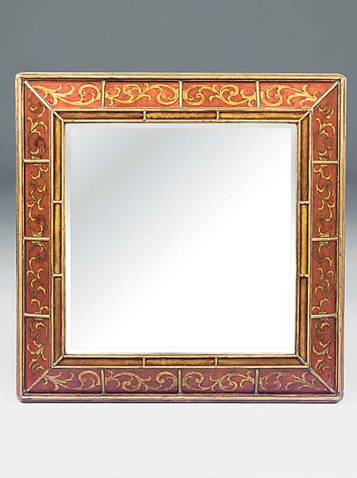A GILTWOOD AND REVERSE PAINTED GLASS FRAMED MIRROR