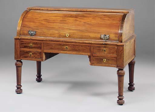 A GERMAN MAHOGANY CYLINDER DESK