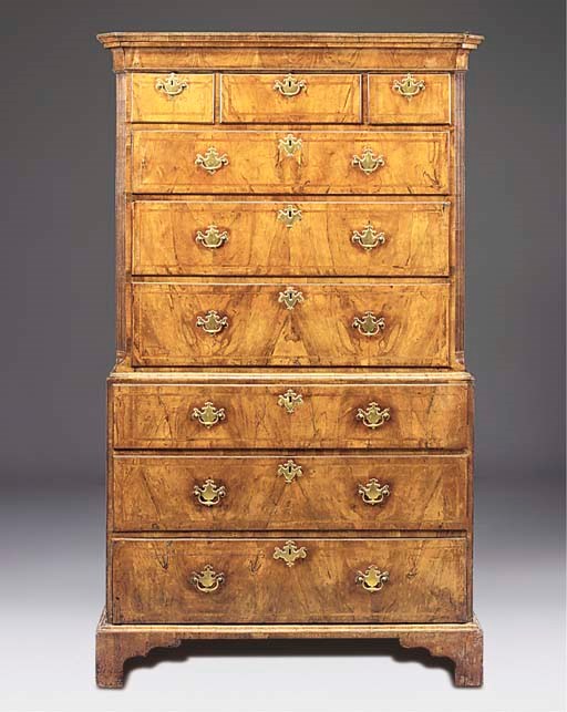 A GEORGE II WALNUT FEATHERBANDED TALLBOY