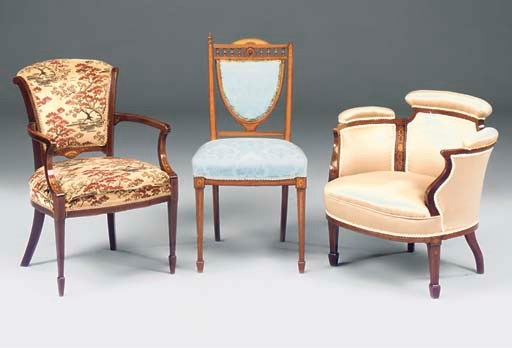 An Edwardian mahogany and inlaid tub chair