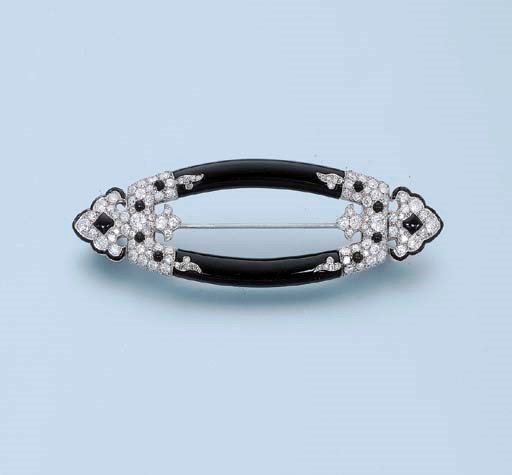 AN ART DECO ONYX AND DIAMOND PANEL BROOCH, BY CARTIER