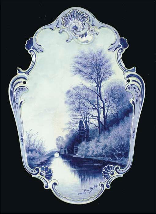 A Dutch Delft blue and white landscape plaque