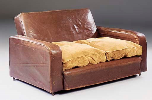 A LEATHER-UPHOLSTERED SETTEE