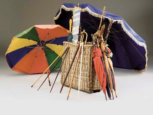 A COLLECTION OF LARGE UMBRELLAS AND PARASOLS