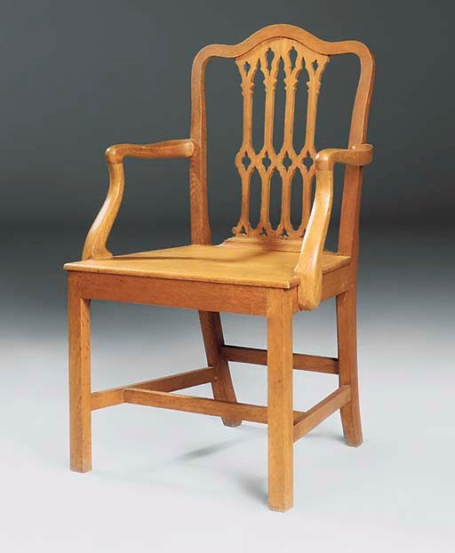 AN EDWARDIAN OAK ARMCHAIR