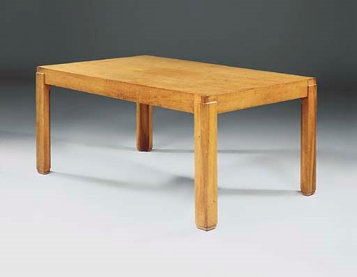 AN ART DECO WALNUT DINING TABLE
