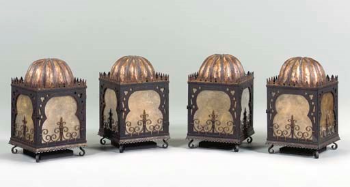 A SET OF FOUR BRONZED AND GILT-METAL STANDING LANTERNS