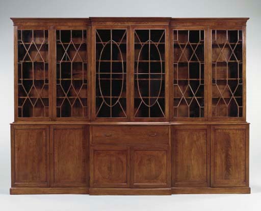 A LATE GEORGE III MAHOGANY BREAKFRONT SECRETAIRE-BOOKCASE