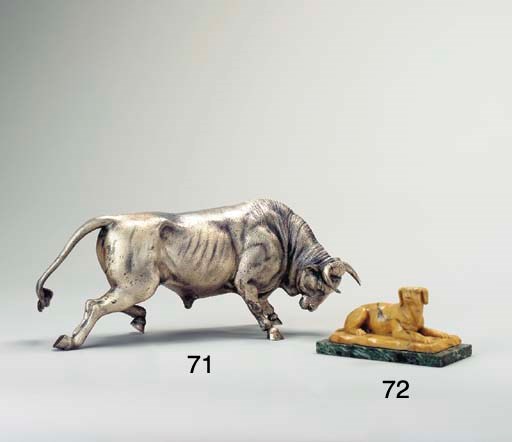 A SIENA MARBLE MODEL OF A RECUMBENT HOUND