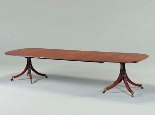 A LATE GEORGE III MAHOGANY TWIN-PEDESTAL DINING-TABLE