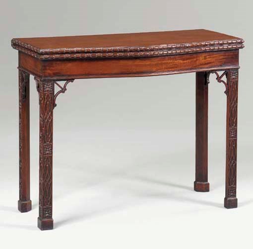 A GEORGE III MAHOGANY CONCERTINA-ACTION GAMES TABLE