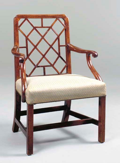 A GEORGE III MAHOGANY COCKPEN ARMCHAIR