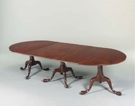 A GEORGE III MAHOGANY TRIPLE-PEDESTAL DINING-TABLE