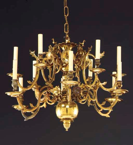 A CONTINENTAL BRASS TWELVE-LIGHT CHANDELIER