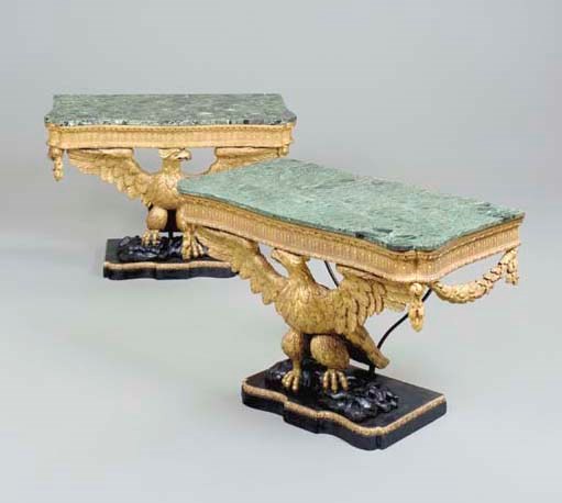 A PAIR OF GEORGE II STYLE GILTWOOD AND EBONISED CONSOLE TABLES