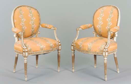 A PAIR OF GEORGE III WHITE-PAINTED AND PARCEL-GILT OPEN ARMCHAIRS