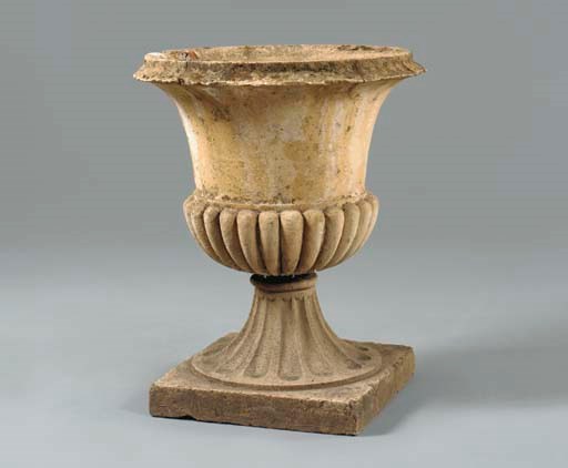AN EARLY VICTORIAN COMPOSITE STONE CAMPANA GARDEN URN
