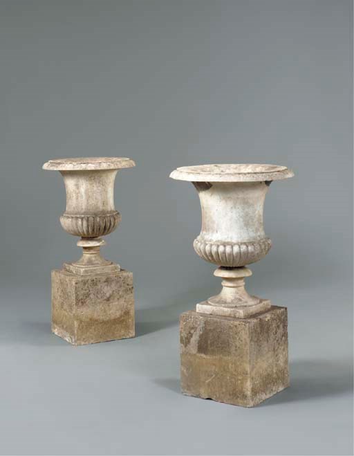 A PAIR OF REGENCY WHITE MARBLE CAMPANA URNS