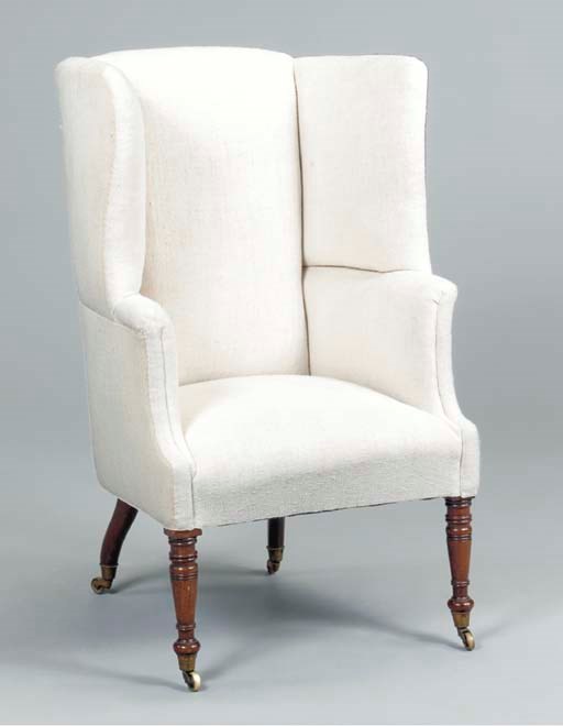 A REGENCY MAHOGANY BARREL-BACK WING ARMCHAIR