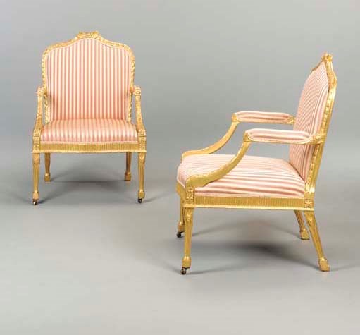 A PAIR OF GEORGE III GILTWOOD ARMCHAIRS