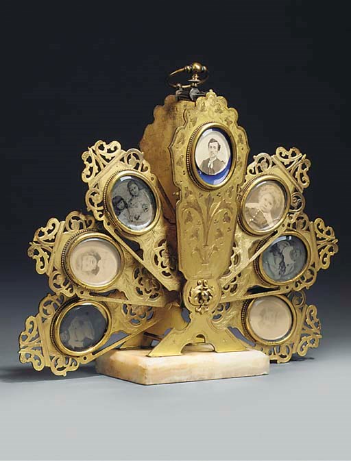 A LATE VICTORIAN FAN SCREEN PHOTO FRAME