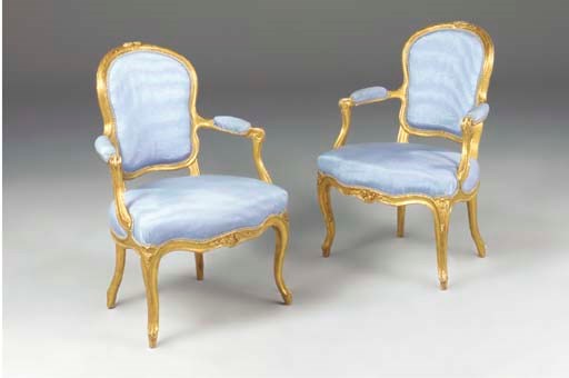 A PAIR OF LOUIS XV GILTWOOD FAUTEUILS EN CABRIOLET