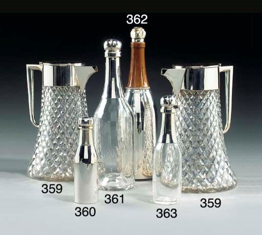A PAIR OF MAPPIN AND WEBB SILVER PLATED AND GLASS LEMONADE JUGS