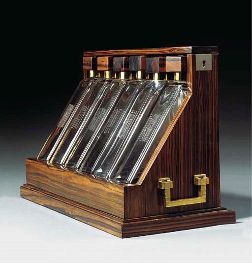 AN ART DECO MACASSAR EBONY VENEERED TANTALUS