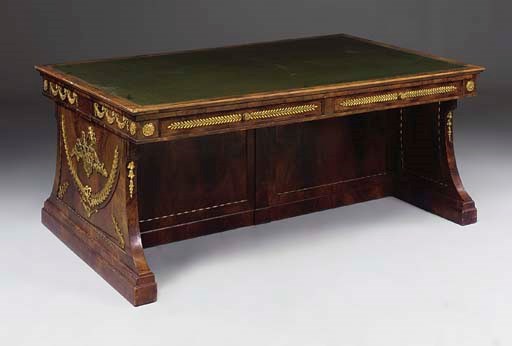 A FRENCH MAHOGANY AND ORMOLU MOUNTED BUREAU PLAT