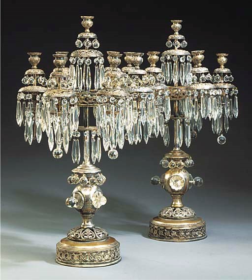 A PAIR OF GLASS AND SILVER PLATED SEVEN LIGHT CANDELABRA