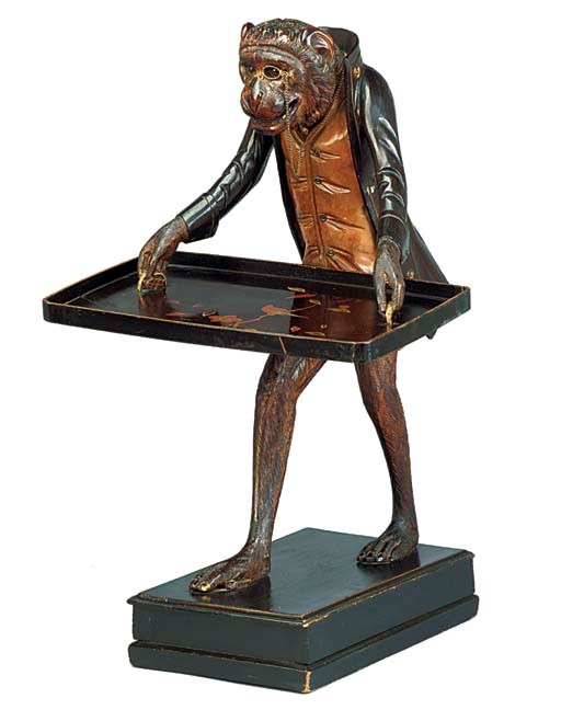 A CONTINENTAL CARVED WOOD DUMBWAITER