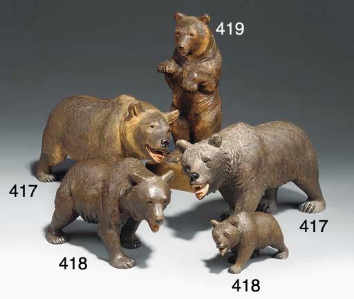TWO SWISS 'BLACK FOREST' CARVED WOOD STROLLING BEARS