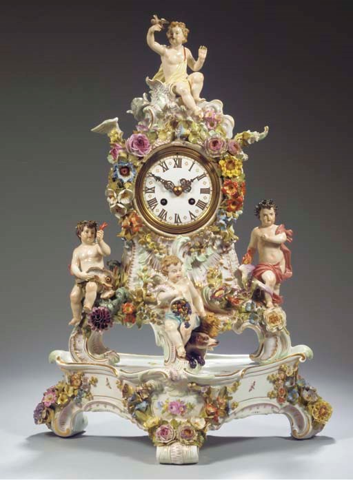 (2)  A Meissen porcelain flower-encrusted tripod clock case and stand emblematic of the Four Elements